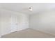 Carpeted bedroom featuring two closets at 833 Ember Dr, Durham, NC 27703