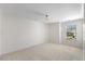 Bright bedroom with neutral carpet and a window offering outdoor views at 833 Ember Dr, Durham, NC 27703