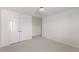 This bedroom has neutral carpeting and a closet with double doors at 833 Ember Dr, Durham, NC 27703