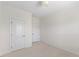 Bedroom featuring plush carpeting, neutral walls, and classic white doors at 833 Ember Dr, Durham, NC 27703