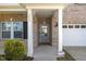 Charming entrance featuring a brick facade and white columns at 833 Ember Dr, Durham, NC 27703