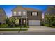 Charming two-story home featuring a brick facade, two-car garage, and well-maintained landscaping at 833 Ember Dr, Durham, NC 27703