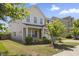 Charming two-story home featuring a brick facade and well-maintained landscaping at 833 Ember Dr, Durham, NC 27703