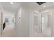 Hallway with carpet, multiple doorways, and natural light from a window at 833 Ember Dr, Durham, NC 27703