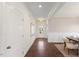 Inviting hallway featuring dark wood floors, white molding and light-colored walls at 833 Ember Dr, Durham, NC 27703