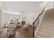 Sunlit living room featuring a fireplace, staircase and beautiful hardwood floors at 833 Ember Dr, Durham, NC 27703