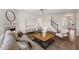 Inviting living room with fireplace, ceiling fan, and a decorative rug at 833 Ember Dr, Durham, NC 27703