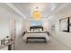 Main bedroom featuring a decorative ceiling and natural light from the windows at 833 Ember Dr, Durham, NC 27703