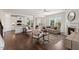 Bright open-concept kitchen and living room space with hardwood floors and lots of natural light at 833 Ember Dr, Durham, NC 27703
