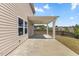 Covered patio featuring a ceiling fan, concrete slab, and views of the backyard at 833 Ember Dr, Durham, NC 27703