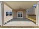 Covered patio with concrete slab, ceiling fan, and view of the backyard at 833 Ember Dr, Durham, NC 27703