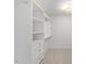 This is a large walk-in closet with custom shelving and cabinetry at 833 Ember Dr, Durham, NC 27703