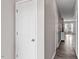 Inviting hallway with wood-look flooring, leading to the main living area and other rooms at 878 John St, Clayton, NC 27520