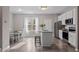 Bright kitchen with granite countertops, stainless steel appliances and a cozy breakfast nook at 878 John St, Clayton, NC 27520