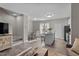 Open concept living area features hardwood floors and staircase to the second story at 878 John St, Clayton, NC 27520