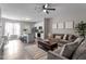 Open-concept living space with a dining area, kitchen and an island with seating, connecting the rooms at 878 John St, Clayton, NC 27520