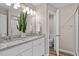Bright bathroom features a double vanity, granite countertop, and modern fixtures at 882 John St, Clayton, NC 27520