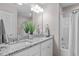 Bright bathroom featuring double vanity, granite countertop, and modern fixtures and bathtub at 882 John St, Clayton, NC 27520