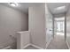 Second floor hallway featuring carpet, light-colored walls, and white doors leading to bedrooms at 882 John St, Clayton, NC 27520