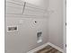 Convenient laundry room includes washer and dryer hookups with overhead shelving at 886 John St, Clayton, NC 27520