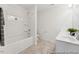 Bright bathroom featuring a shower-tub combination, double sink vanity, and neutral color scheme at 92 Horseshoe Pl # 9, Angier, NC 27501