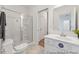 Modern bathroom with glass enclosed shower, white vanity with sink, and neutral floor tiles at 92 Horseshoe Pl # 9, Angier, NC 27501