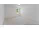 This bright bedroom features neutral paint and a large window at 92 Horseshoe Pl # 9, Angier, NC 27501