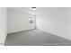Cozy bedroom with a neutral carpet, bright window with great view, and white walls at 92 Horseshoe Pl # 9, Angier, NC 27501