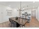 Bright dining room with an elegant chandelier and modern design at 92 Horseshoe Pl # 9, Angier, NC 27501