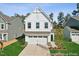 New construction home showcasing a white facade and two-car garage at 92 Horseshoe Pl # 9, Angier, NC 27501