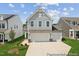 Charming two-story home with a spacious three car garage and landscaped front yard at 92 Horseshoe Pl # 9, Angier, NC 27501