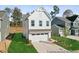 New construction home showcasing a white facade and two-car garage at 92 Horseshoe Pl # 9, Angier, NC 27501