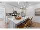 Modern kitchen featuring stainless steel appliances, a large island with seating, and pendant lighting at 92 Horseshoe Pl # 9, Angier, NC 27501