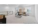 This bright, carpeted living room features contemporary decor and ample natural light at 92 Horseshoe Pl # 9, Angier, NC 27501