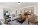 Cozy living room adjacent to a modern kitchen with a large seating area at 92 Horseshoe Pl # 9, Angier, NC 27501