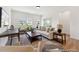 Living room featuring hardwood floors and large windows with plenty of natural light at 92 Horseshoe Pl # 9, Angier, NC 27501
