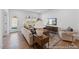 Cozy living area featuring a modern sofa, hardwood floors, and large windows at 92 Horseshoe Pl # 9, Angier, NC 27501