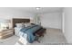 This primary bedroom features carpet, neutral paint and lots of natural light at 92 Horseshoe Pl # 9, Angier, NC 27501