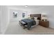 This primary bedroom has carpet, neutral paint and lots of natural light at 92 Horseshoe Pl # 9, Angier, NC 27501