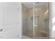 Contemporary shower with tiled walls, flooring, and glass enclosure at 92 Horseshoe Pl # 9, Angier, NC 27501