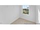 A walk-in closet with carpet and a window is a great storage space at 92 Horseshoe Pl # 9, Angier, NC 27501