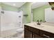 Bathroom featuring a tub and shower combo, dark wood cabinets and sink with mirror at 10 W Ravano Dr, Clayton, NC 27527