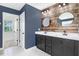Stylish bathroom features double sinks, wood accent wall, and modern fixtures at 10 W Ravano Dr, Clayton, NC 27527