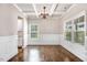Elegant dining room featuring coffered ceilings, hardwood floors, and natural light from large windows at 10 W Ravano Dr, Clayton, NC 27527