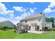 Exterior of a two-story home with a screened-in porch and a hot tub in the backyard at 10 W Ravano Dr, Clayton, NC 27527