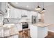 Stylish kitchen with white cabinets, granite countertops, stainless steel appliances, and a functional island at 10 W Ravano Dr, Clayton, NC 27527