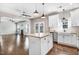 Bright kitchen boasts granite countertops, modern appliances, and a large island at 10 W Ravano Dr, Clayton, NC 27527