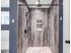 Luxurious shower stall with stylish tilework, rainfall shower head, and built-in niche at 10 W Ravano Dr, Clayton, NC 27527