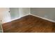 Bedroom featuring hardwood floors, light paint, and a closet with sliding doors at 102 Pebble Ct, Chapel Hill, NC 27516