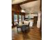 Bright dining area adjacent to the kitchen with views of the wooded outdoors at 102 Pebble Ct, Chapel Hill, NC 27516